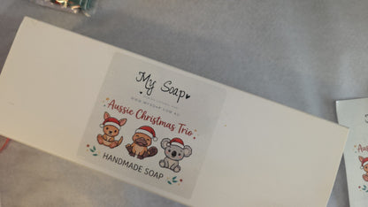 My Soap Aussie Christmas Trio gift box featuring illustrations of a kangaroo, platypus, and koala in Santa hats.