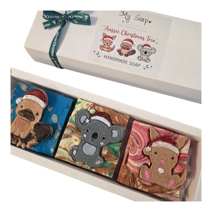 My Soap Aussie Christmas Trio handmade soaps featuring kangaroo, platypus, and koala designs with festive Santa hats.